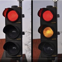 For the purposes of a road test, yellow and red lights are the same colour. In other words, you must stop for both!