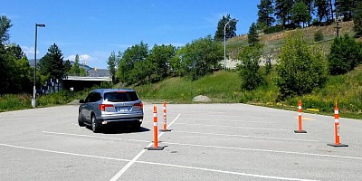 After you adjust the seat, learn the transmission, and start the car, drive in a parking lot.