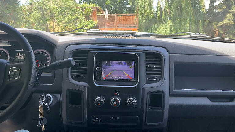 When you put the transmission into reverse, the backup camera will come on automatically.