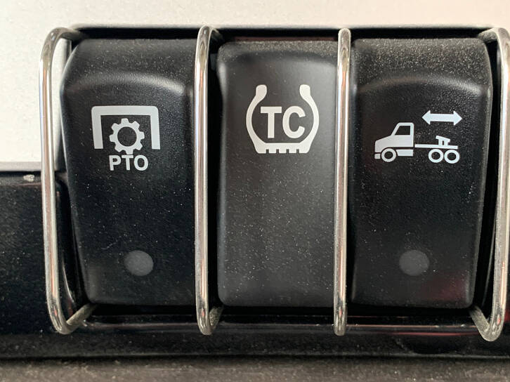 From left-to-right you have the Power Take OFF, the Traction Control, and the 5th Wheel Lock Switches.