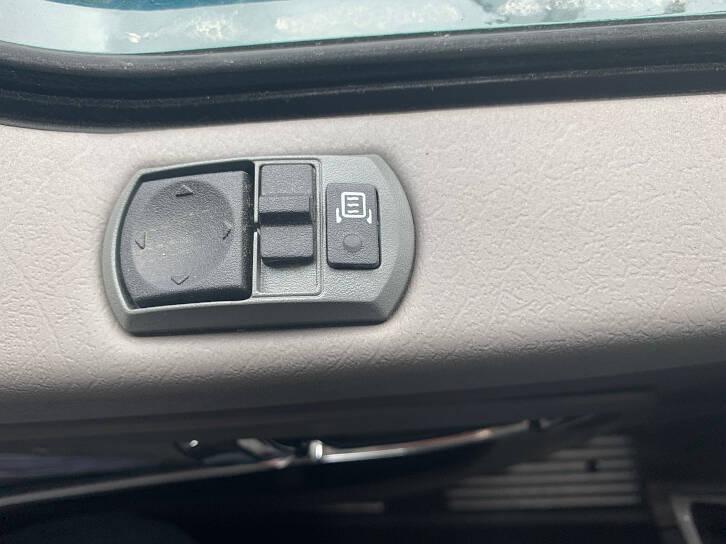 On new big trucks, the mirrors can be adjusted with the touch of the switch and are heated so these stay clear.