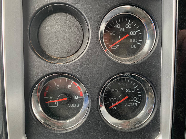 The engine oil pressure, alternator volts, and engine water temperature gauges must be constantly monitored when driving.