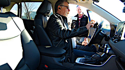 Nelson Chateauneuf demonstrating the spinner know for drivers with disabilities to allow them to drive with hand controls.
