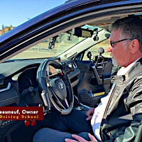Nelson Chateauneuf of Southtrail Driving School demonstrate the controls available to drivers with diabilities.