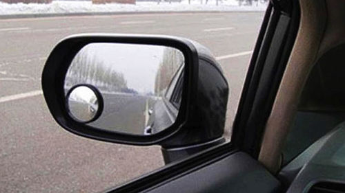 Stick on convex mirrors can help greatly with seeing into the blind areas around your vehicle. However, you must still shoulder (head) check.
