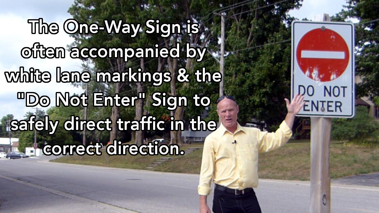 The One-Way Sign is often accompanied by white lane markings and the 