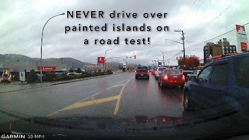 Driving over a painted island on a road test could cause you to FAIL!