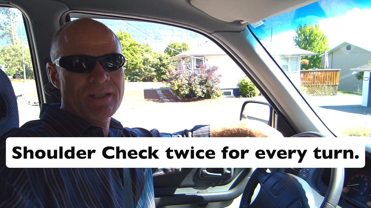 On a road test, a driver must shoulder check twice when turning, merging, or moving the vehicle sideways.
