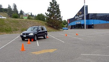 Hitting the cones is not a bad thing. It teaches you where your vehicle is in relation to other objects on the road.